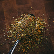 Ray's Loco Gringo Southwest Seasoning on spoon showing the spice out of bottle. 